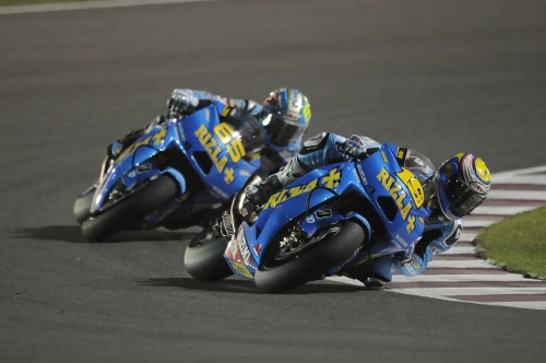 Capirossi battles to ninth in Qatar thriller